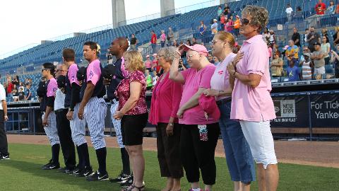 Breast Cancer survivors took the field with the T-Yanks for the National Anthem. (Mark LoMoglio/Yankees)